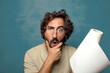© kues1 - young adult bearded man with a paper towel roll