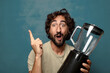 © kues1 - young adult bearded man with a blender machine