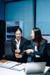 © Nuttapong punna - Two professional businesswomen analyzing reports and planning strategy at office desk. Teamwork, collaboration, management, consulting and modern corporate workplace.