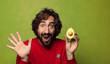 © kues1 - young adult bearded man with an avocado