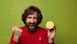 © kues1 - young adult bearded man with an orange