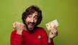 © kues1 - young adult bearded man with a fifty euros bill