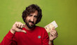 © kues1 - young adult bearded man with a fifty euros bill