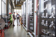 © Westend61 - Two men examining product in modern factory