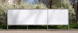 © Outlander1746 - Long white vinyl banner on fence in urban park, Blank hoarding mockup, billboard, signage in city with green blossoming spring trees. Commercial advertisement, public information canvas. Mock up space