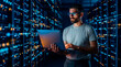 © Rendara Studio - IT specialist working on a laptop inside a server room