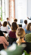 © olgakris - Presenting at a business conference, diverse audience learning, educational seminar teamwork, professional development workshop, corporate training session, innovative collaboration strategy