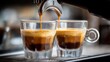 © Aquir - Espresso machine pouring hot coffee into glass cups. Espresso machine pouring fresh coffee with rich crema into two small glass cups