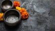 © ngstock - Songkran festival celebrations with traditional silver bowls and marigolds on wet stone surface in thailand