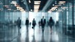 © CLOVER BACKGROUND - Blurred Corridor: Silhouetted figures of professionals traverse a sleek, modern corridor, conveying a sense of purpose and the flow of daily business life.