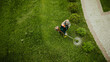 © Polivan - the lawnmower man mows the lawn the view from the top