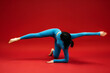 © wedmoments.stock - Beautiful young woman stretching on red isolated background. Fitness, flexibility and healthy lifestyle concept.
