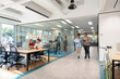 © Santi Nuñez/Stocksy - Diverse startup team collaborating in modern open-plan office