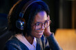 © Artcore Studio/Stocksy - Woman listens to music while working