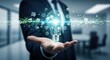 © su - Business hand holding a virtual lightbulb that radiates geometric data lines, symbolizing innovation and smart technology ideas.