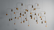 © Marcos Osorio/Stocksy - Decorative mobile hangs from the ceiling in modern interior space