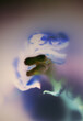 © Natalia Mishina/Stocksy - A dinosaur figure is shown with colorful effects