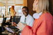 © VICTOR TORRES/Stocksy - Modern office meeting with diverse team collaboration