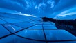 © marni - Modern Solar Panel Array Reflecting Dramatic Blue Sky at Dusk.