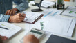 © Charlie's - business man Auditor or internal revenue service staff checking annual financial statements company Audit  Accounting tax.