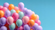 © aboutnuylove - Colorful balloons on a blue background with copy space for text.