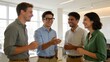 © Gianna - Four people in office conversation