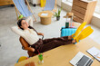 © Pixel-Shot - Happy businesswoman relaxing in office before vacation