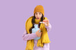 © Pixel-Shot - Ill shocked young woman with hot water bag and thermometer on lilac background