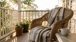 © Николай Срибяник - Wicker armchair and cozy blanket on a home veranda at sunrise.