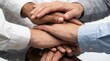 © AspctStyle - Diverse business team hands stacking together in a close-up isolated shot on a white background, symbolizing partnership and corporate unity concept.