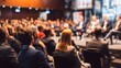 © Nail - Business conference with speakers on stage and an audience in a large hall. Concept: Business networking, entrepreneurship, knowledge sharing, leadership and innovation events