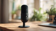 © Olajumoke - close up a black podcast microphone in a home studio  with soft bokeh of a modern workspace scene for podcasting, microphone on the table, microphone on the desk, microphone