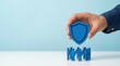 © R Studio - insurance protection security safety shield people group representing life and health insurance coverage for employees or a community in a professional environment.