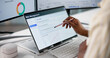 © Andrey Popov - Female Risk Management Analyst Using Laptop