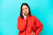 © luismolinero - Young caucasian woman isolated on blue background suffering from pain in shoulder for having made an effort