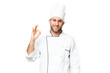 © luismolinero - Young blonde man Chef over isolated chroma key background showing ok sign with fingers