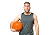© luismolinero - Handsome young man playing basketball over isolated chroma key background looking up and with surprised expression