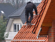 © Christian Bunge - Worker on the roof installing a solar power system
