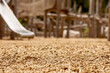 © Maryana - Playground Wood Chips Play Area Cover. Natural Wooden Chips Woodchip on Modern Playground Surface.