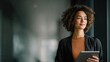 © darshika - Confident woman with tablet looking away