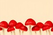 © Khadiza - Vibrant Red Mushrooms in a Row on Soft Beige Background