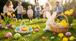 © FOODART - Happy Easter celebration Family enjoys an outdoor egg hunt in a sunny garden with colorful decorations and a cute bunny