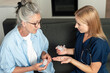 © brizmaker - Doctor provides medication guidance to elderly patient during home visit