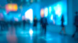 © Surachetsh - A high quality blurred scene shows people mingling at a networking event in a bright modern conference hall with soft architectural lighting.