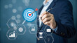 © Jobcens - Goal setting and strategic focus using digital interface. businessman selecting target icon and strategy dashboard. strategic planning, performance tracking and digital business management