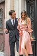 © rilueda - Elegant couple sharing affection on an urban street