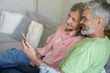 © zinkevych - Happy couple enjoying time together looking at smartphone screen