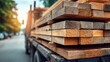 © LumeoStudio - Lumber being transported on a truck on a sunny day.