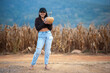 © Pongsorn - Asian woman holding pumpkin in rice field