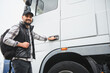 © Serhii - Happy smiling truck driver starting his work day